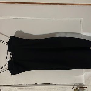 Black dress with cross opening in middle.